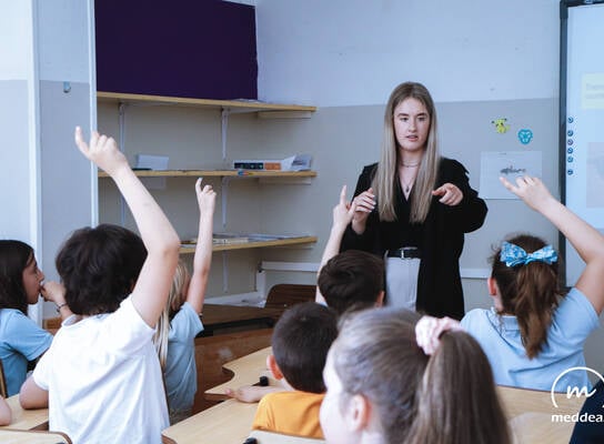 Meddeas Language Assistant with her students