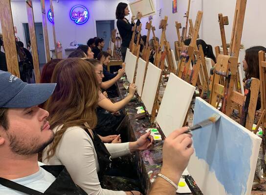 Students enjoy glow painting in Spain