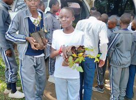 children receiving tree seedlings