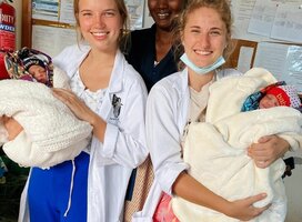 Volunteer providing hands-on medical assistance in a Tanzanian clinic