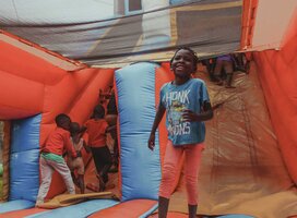 Young children jumping on a bouncing castle