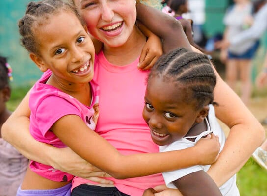 VISIONS Dominican Republic local kids with participant