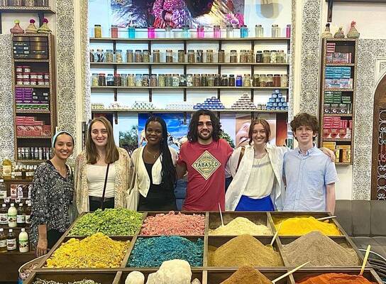 Group of 7 APA Multi-Country students at a spice market in Morocco.