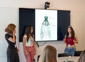 Students giving presentation on fashion-related topic