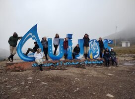 Students in Front of Quijos Sign