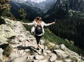 A girl walking through the moutains