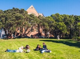 student relaxing on the grass