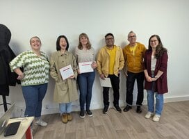 Students and teachers celebrating during the certificate distribution ceremony at the end of the course.