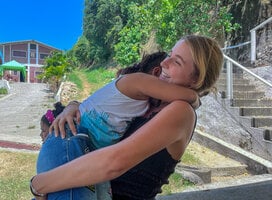 blonde woman hugging child