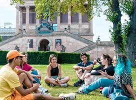 EF language year abroad students hanging out together in a central city park