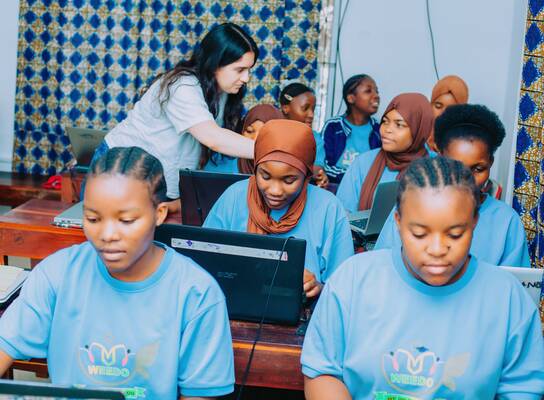 One of our interns at the class, training girls computer