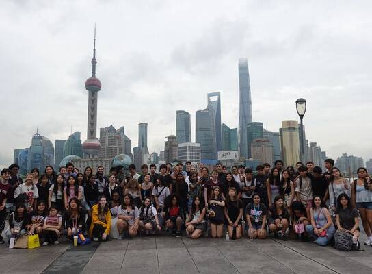 Gap students with Shanghai skyline behind them