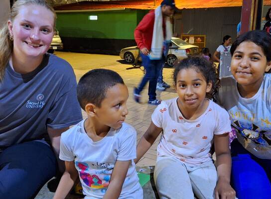 Volunteer with local children 