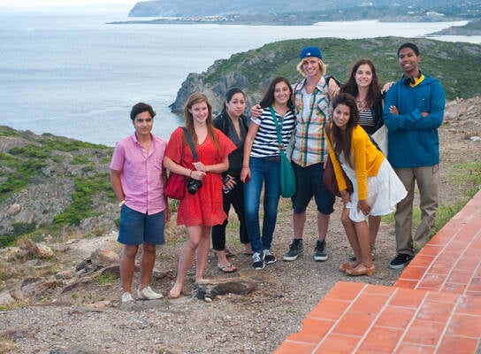 Group of students pose for photo on coast of Spain