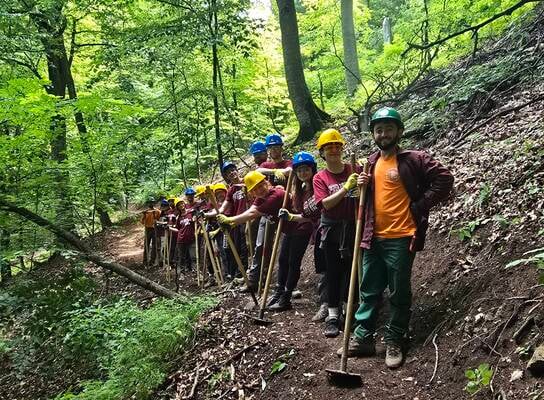 Our international volunteer crew on their way back to camp after a long day of hard, rewarding trail work