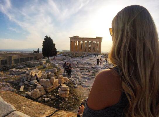 Girl looking out over Athenian ruins