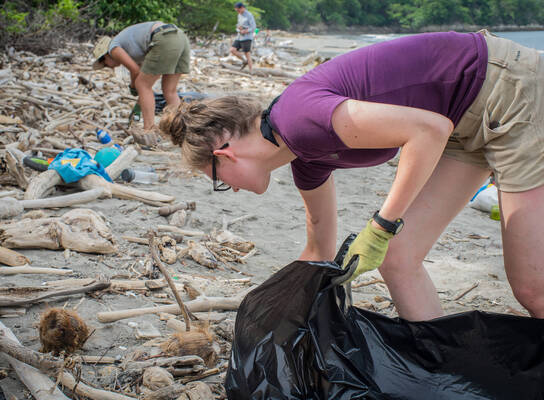 Volunteers collecting waste during a beach clean-up in Costa Rica