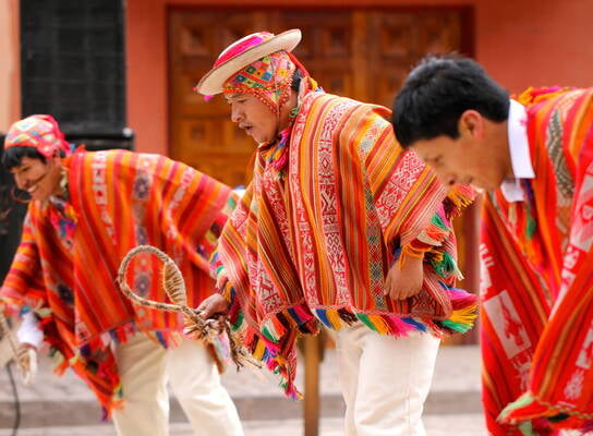 Men in traditional clothing in Peru.