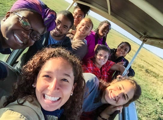 Group photo in safari vehicle.