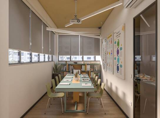 The classroom is used for both online and in-person courses and has a maximum capacity of 10 students. It includes a study library with teaching materials, a projector, a writing board, and visual learning aids displayed on the walls.