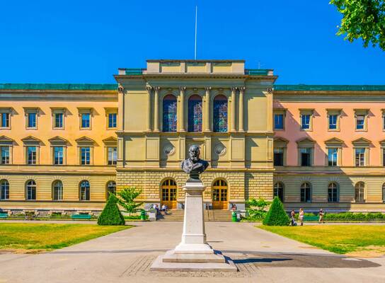 historic building with a large statue in front