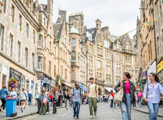 Students exploring Cockburn Street in Edinburgh's old town