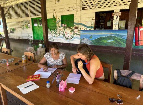 A women studying with local teacher