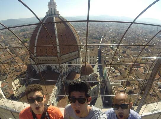 Three students look out over the Duomo in Florence, Italy.