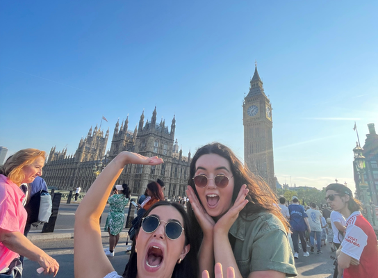 Two women in front of Big Ben in London