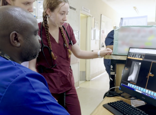Medical interns learning to read an x-ray 