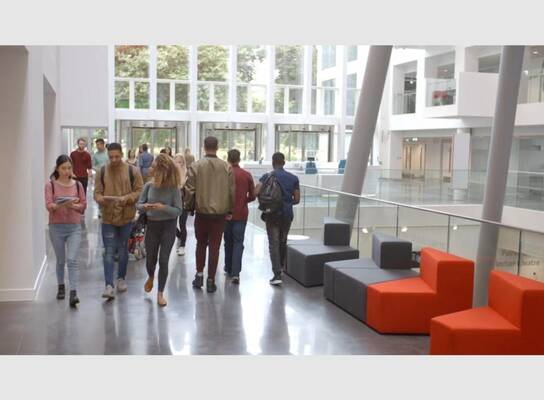Students in a modern office building lobby, representative of Intern Gateway placements
