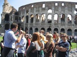 Students in front of Roman Coliseum in Rome