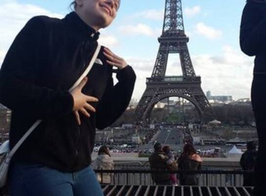 Student from IBS Winter One posing contently by the Eiffel Tower in Paris!