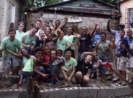 group of volunteers in front of building