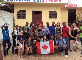 Group of volunteers in front of building