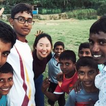 After playing volleyball with local boys, they want me to take a selfie with them.