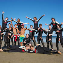 A group of surfers