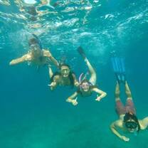 Teens snorkeling off the Galapagos Island