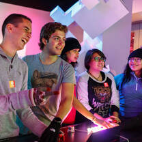 A group of students learning gaming technology