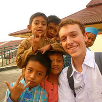 group of school children with study abroad student in India