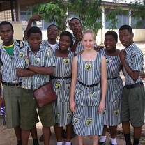 group of students wearing uniforms outside school in Ghana