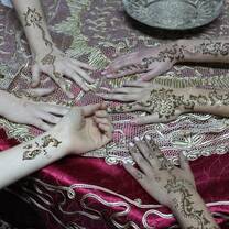 Students get beautiful henna hand art on our Morocco trip!