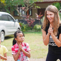 Volunteer Janna (Germany) goofing off with her students outside the classroom.