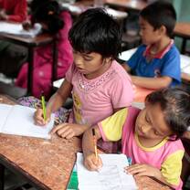 Girls working hard in classroom Nepal