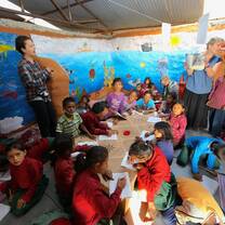 Volunteer teaching in classroom Nepal