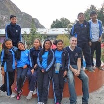 Volunteer Greg with his students