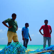 Team at Kelaa removing a ghost net found on an uninhabited beach.