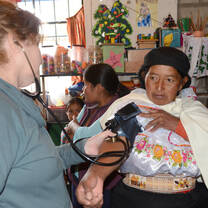Volunteer taking blood pressure Ecuador