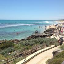 Perth beaches with blue water and building by the beach
