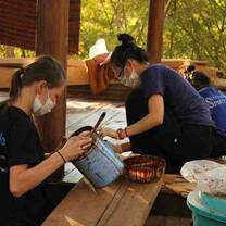 Volunteers and locals painting Thailand 
